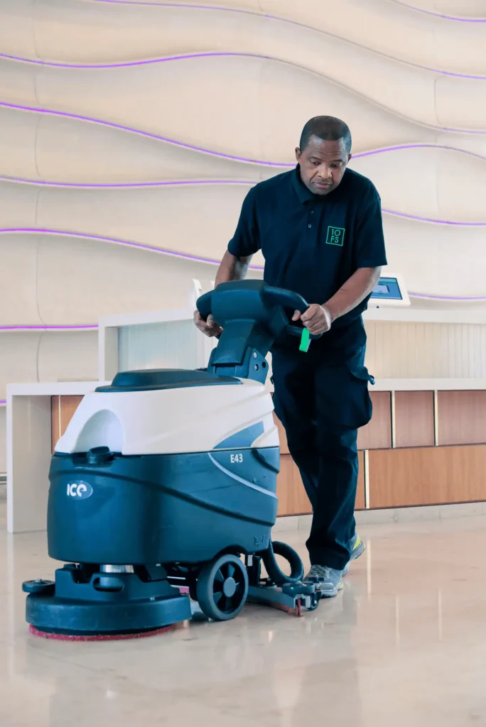 A JPC by Samsic team member cleaning a London office reception