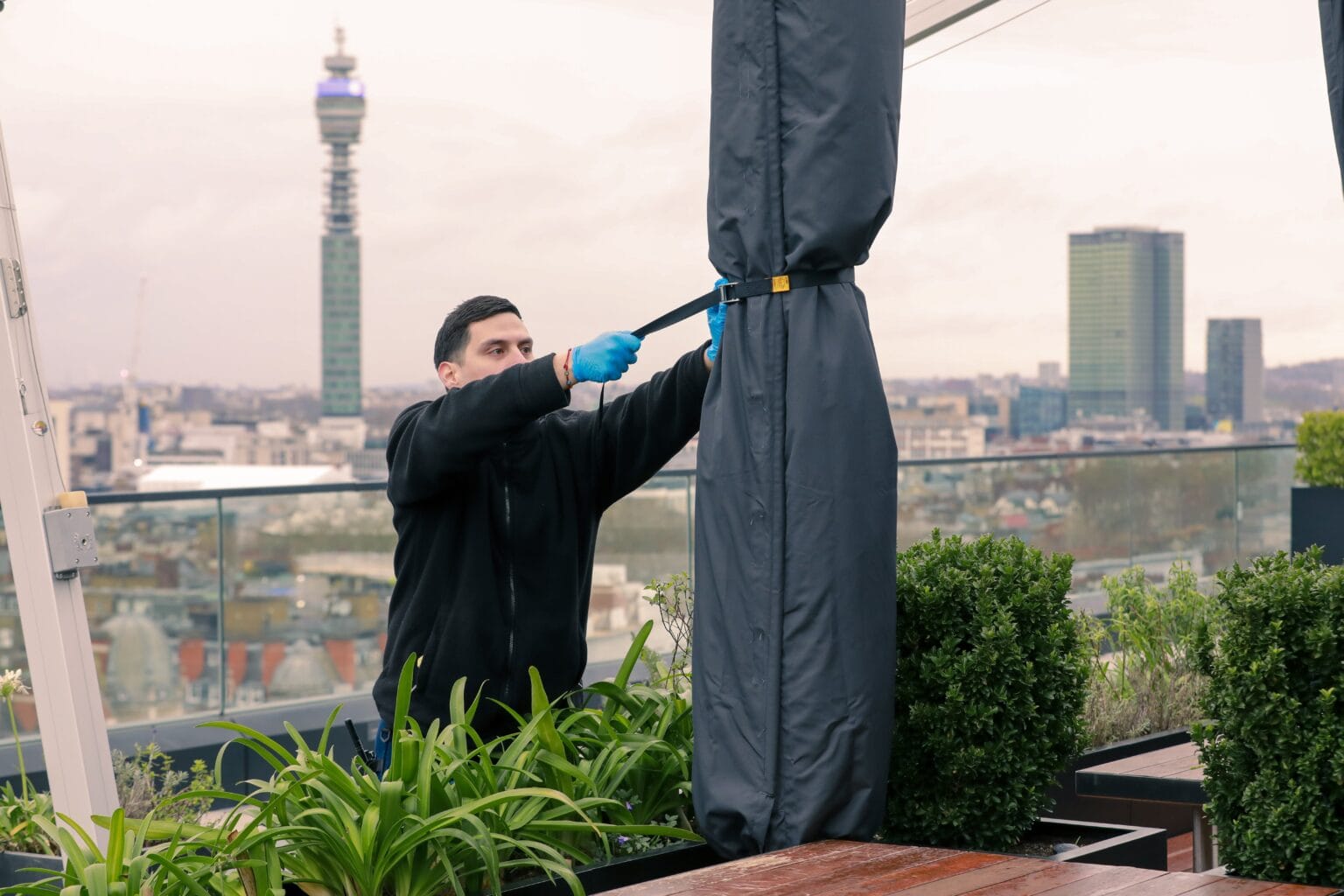 JPC by Samsic cleaner on a London rooftop with the BT Tower behind