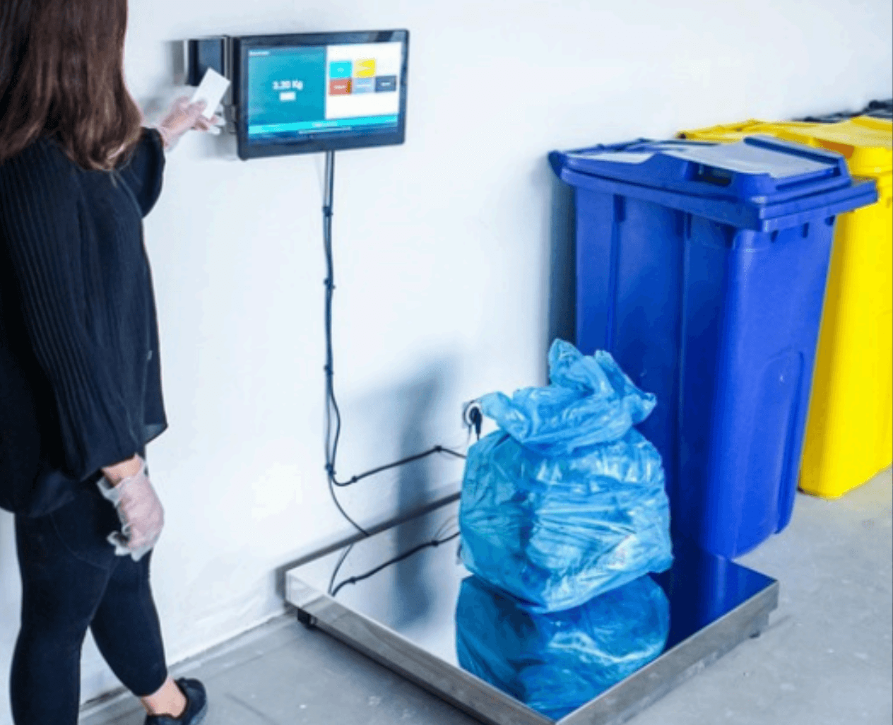 WasteTracker terminal weighing bagged waste at source