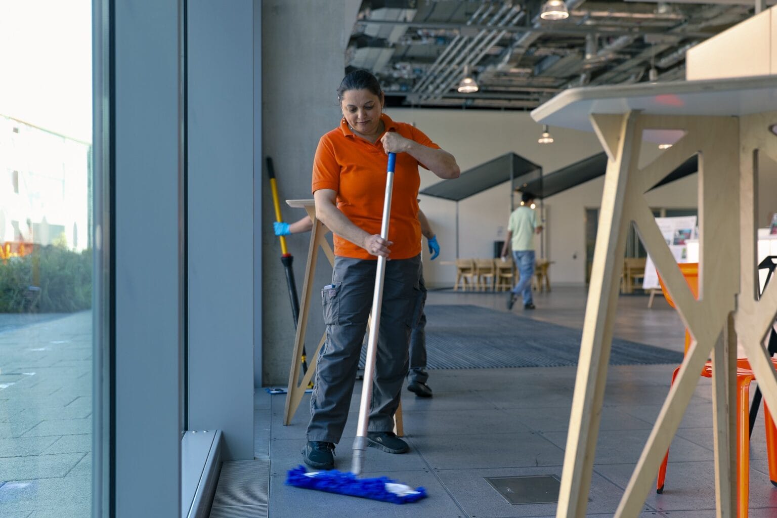 JPC by Samsic cleaner mopping floors in a London workplace