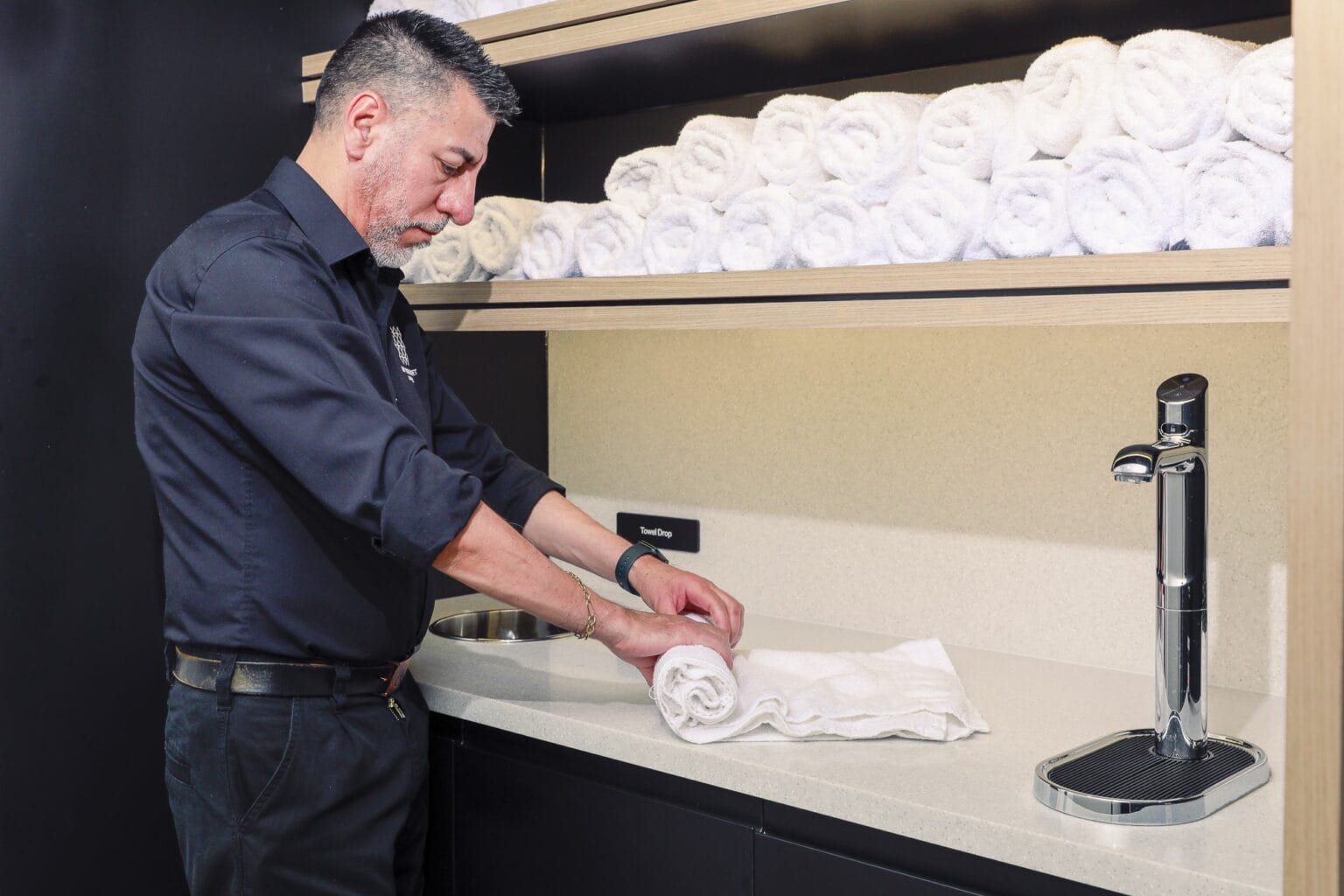 JPC by Samsic team member folding towels