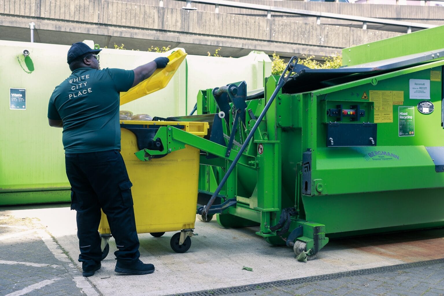 JPC by Samsic team member cleaning commercial waste bins